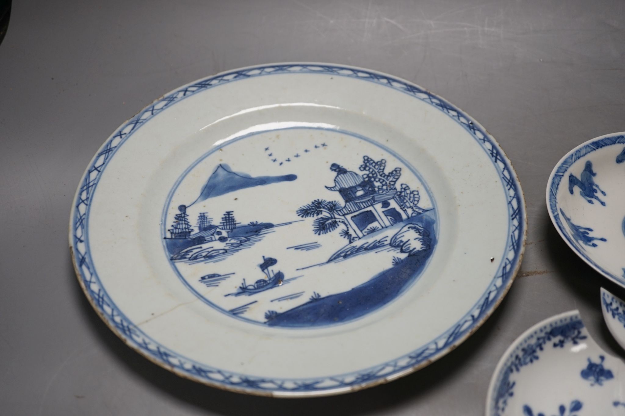 A Chinese blue and white plate, 23.5 cm, a similar tea bowl and saucer, a saucer and a white glaze teapot and cover, 18th century and later